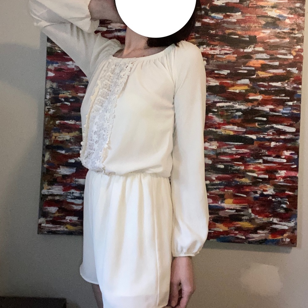 SAGE bohemian jumpsuit shorts, with intricate lace detail and puff sleeves
